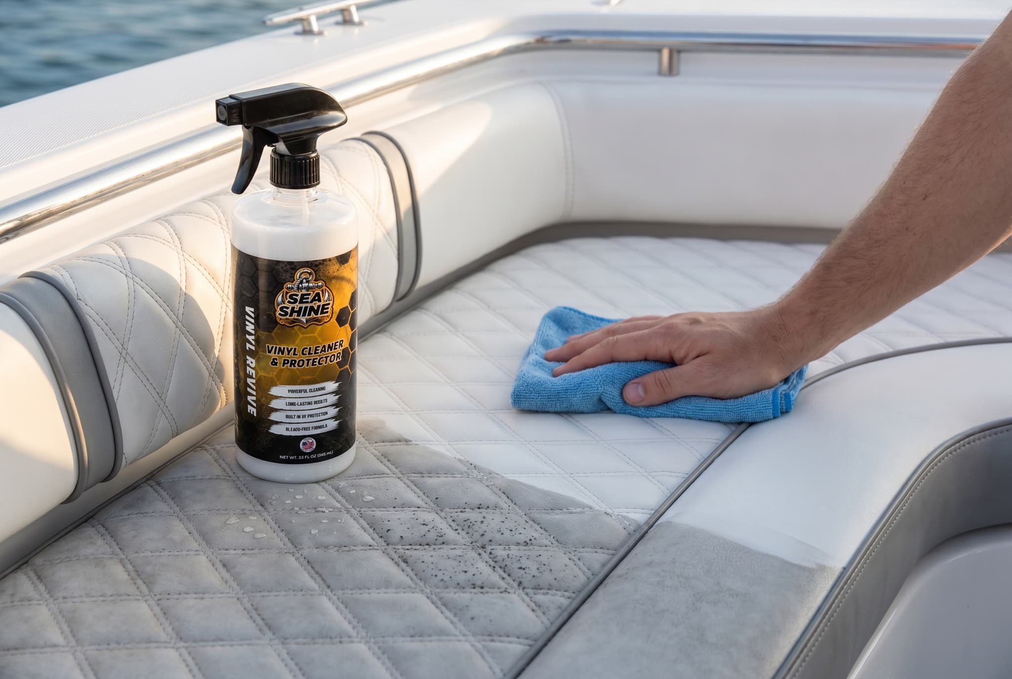 Spraying Vinyl Revive onto a marine seat to clean and protect it